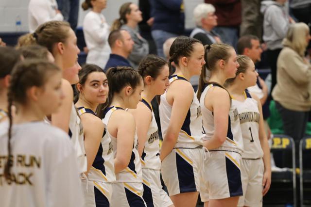 The RCPS varsity girls basketball team lined up for the national anthem at the Bull Run District Tournament on Feb. 12.