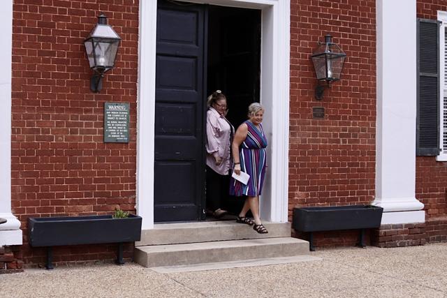 Former Culpeper supervisor and realtor Kathy Campbell, right, leaving the Rappahannock County Courthouse in August after being found in contempt of court.
