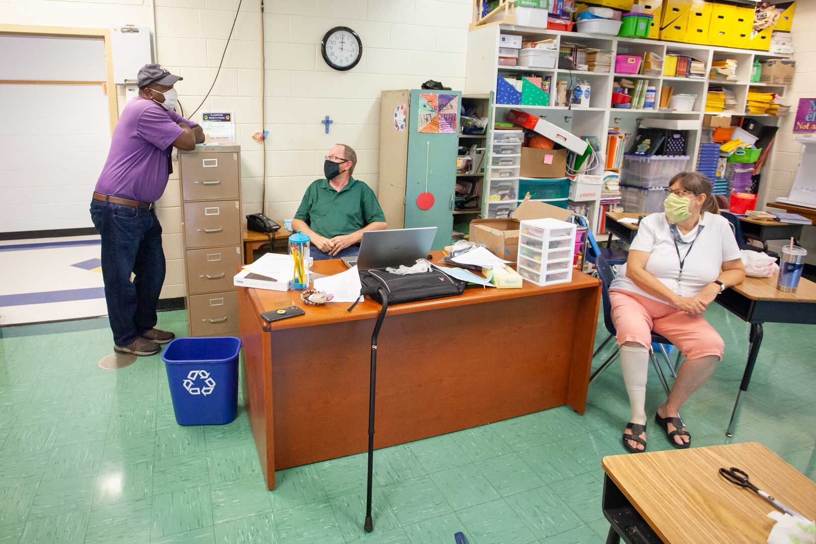 Special Education teacher Robert Glasker, former Technical Education teacher Roy Vickers and Layne Vickers chat in Layne's classroom.
