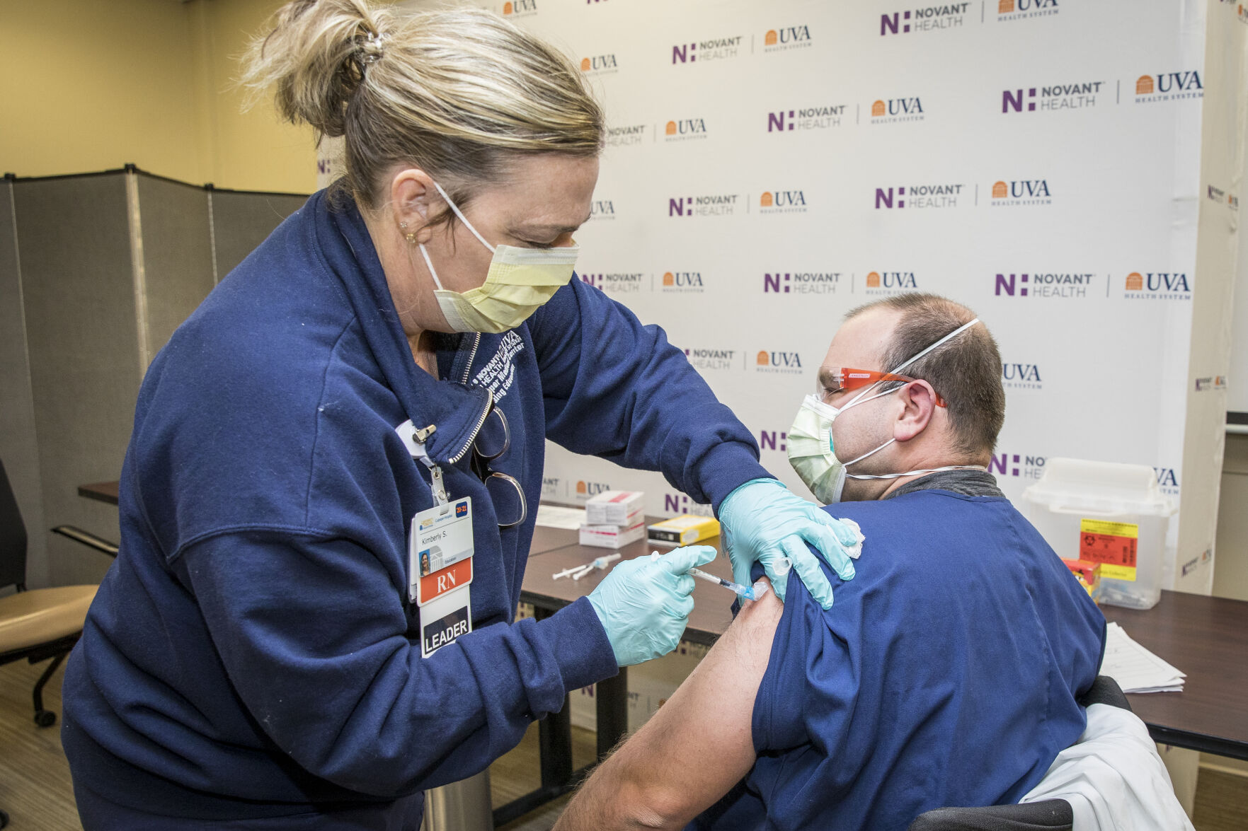 Kim Shuler, RN, administers the Pfizer COVID Vaccine to Charles Akerberg, PA, at the Novant Health UVA Health System Culpeper Medical Center, on Thursday, Dec. 17.