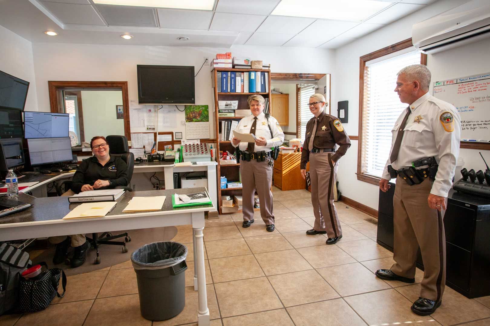 Sheriff Connie Compton, second from left , in her morning briefing with Communications Officer Jennifer Woodward, Lt. Janie Jenkins, and Major Roger Jenkins.
