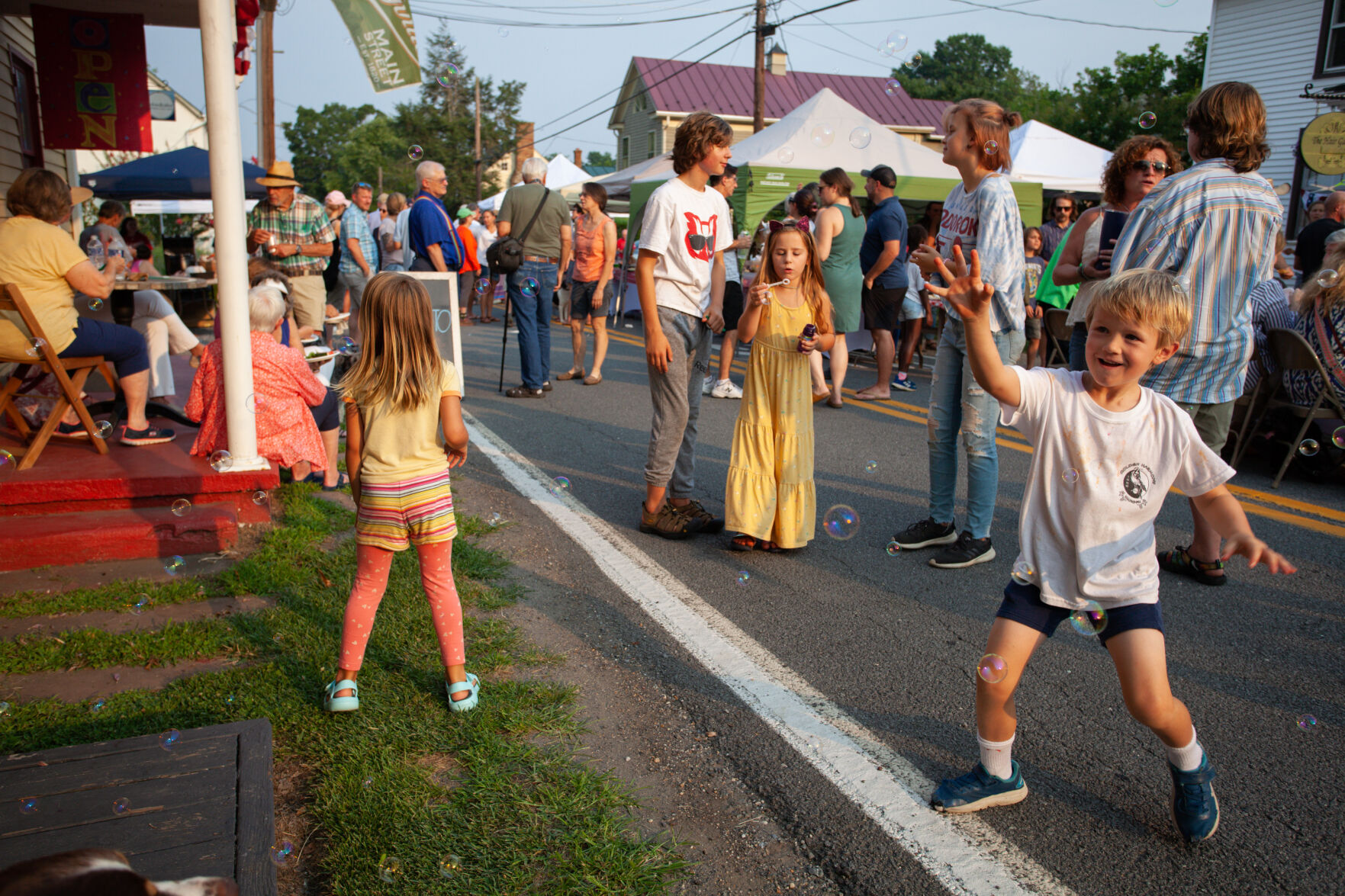 Children play with soap bubbles at the Sperryville street festival.