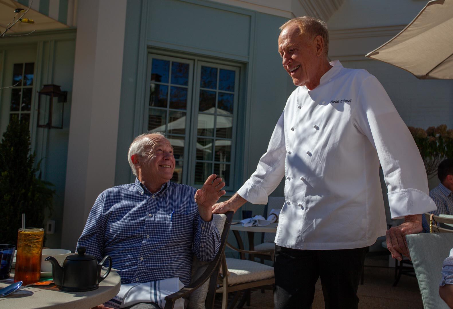 In October, Town of Washington Attorney John Bennett enjoys a moment with Inn at Little Washington Proprietor Patrick O’Connell at a preview lunch at Patty O’s Cafe, the chef’s latest venture.