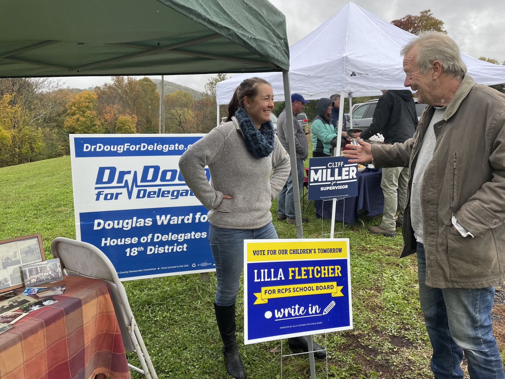 Lilla Fletcher laughing with a voter on election day in November.