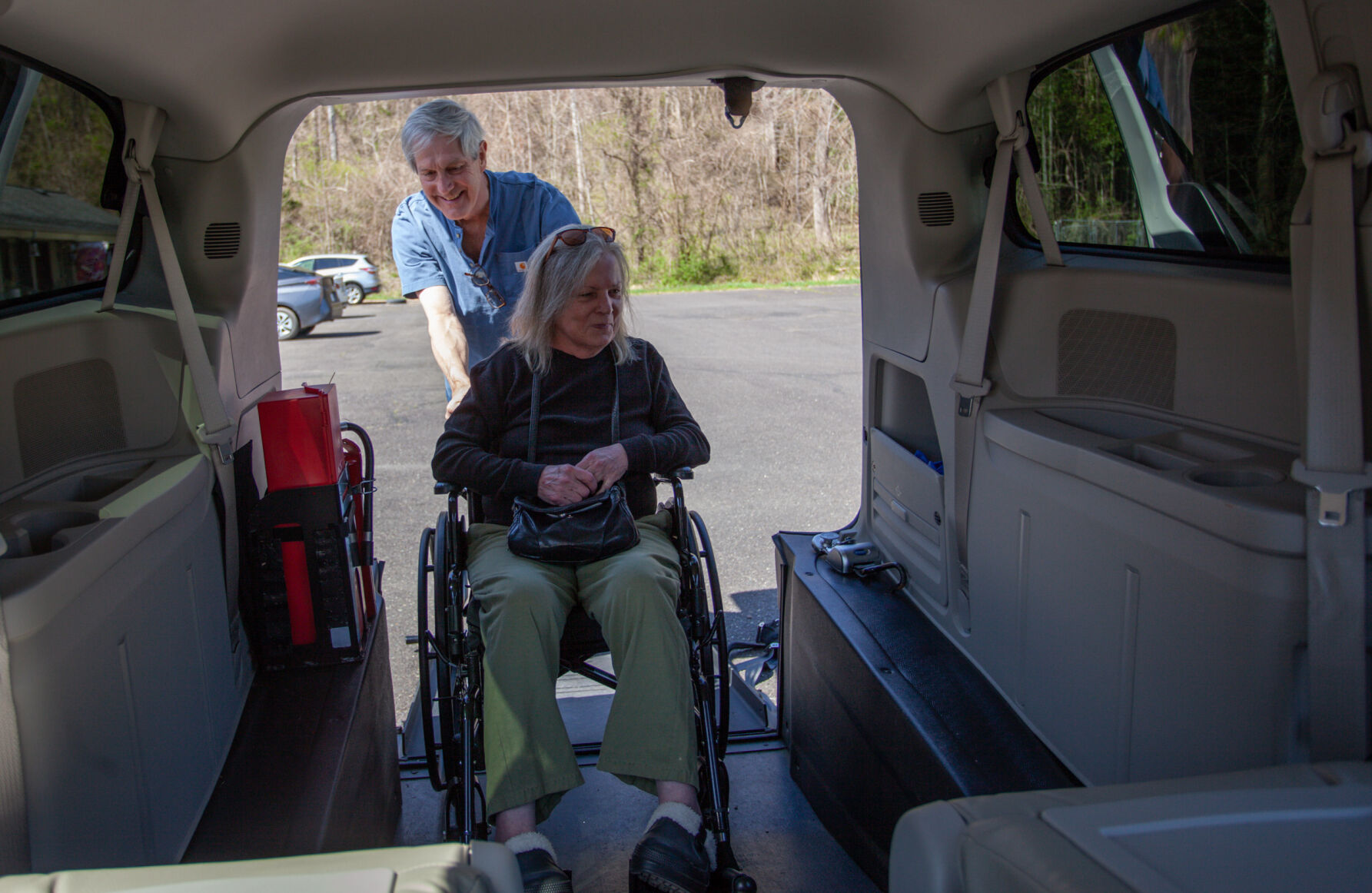Rapp at Home volunteer Mike Wenger assists Debbie Settle into the wheelchair accessible van in Sperryville. Recently, she’s missed appointments because a driver couldn’t be found.