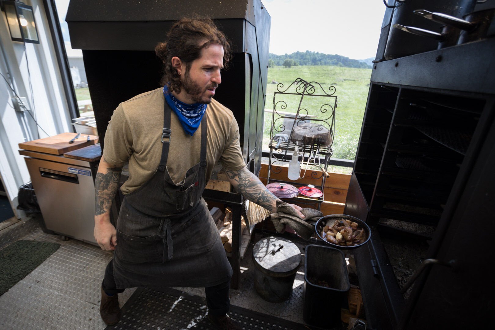 Joseph Baker works the wood-fired grill at Sumac in Sperryville, Va.