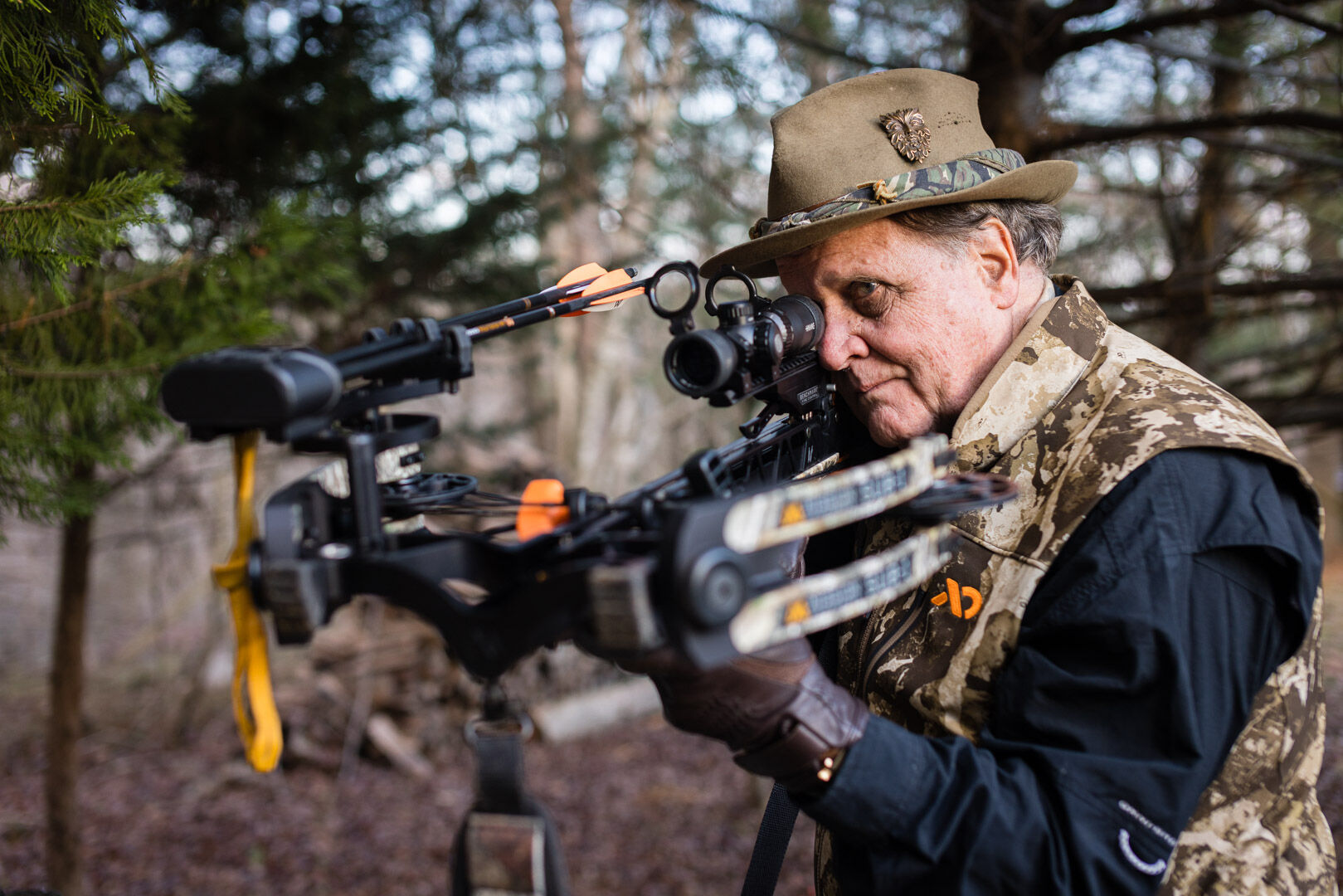 Linn Barnes with his crossbow that can shoot bolts over 440 feet-per-second.