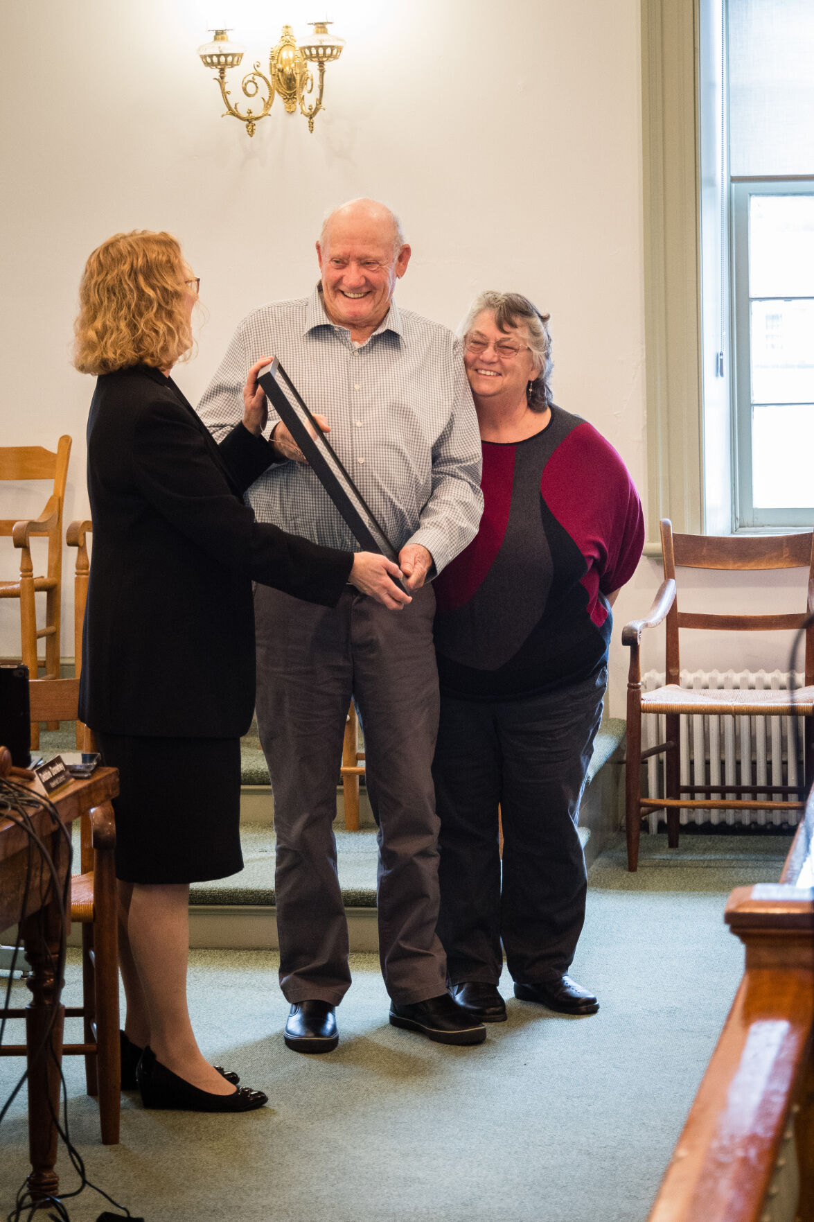 Troy Jenkins, accompanied by his wife Betty, receives a Certificate of Appreciation and Commendation from Chair and Wakefield Supervisor Debbie Donehey at Wednesday’s Board of Supervisors meeting.