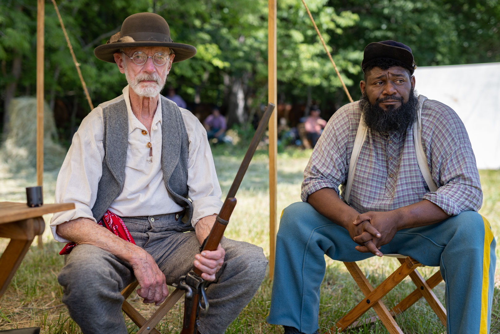 24: Doug Mowery of western Pennsylvania and Nathaniel Williams of Halifax, Va. rest and eat in the Federal camp. Federal soldiers survived on hardtack, a rock-like cake made of flour, water and salt; some called it “tooth duller.” It was usually dipped in coffee to soften.