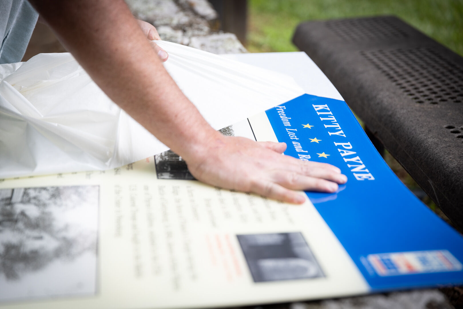 Drew Gruber unwraps the new panel for the new Kitty Payne marker.