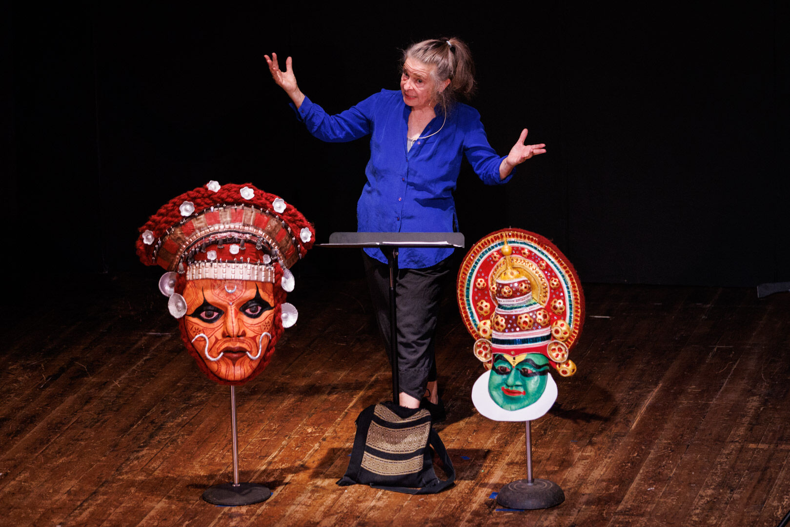 Boomie Pedersen performed the one- person play with brightly painted masks by Mary Bartlett helping set the scene.