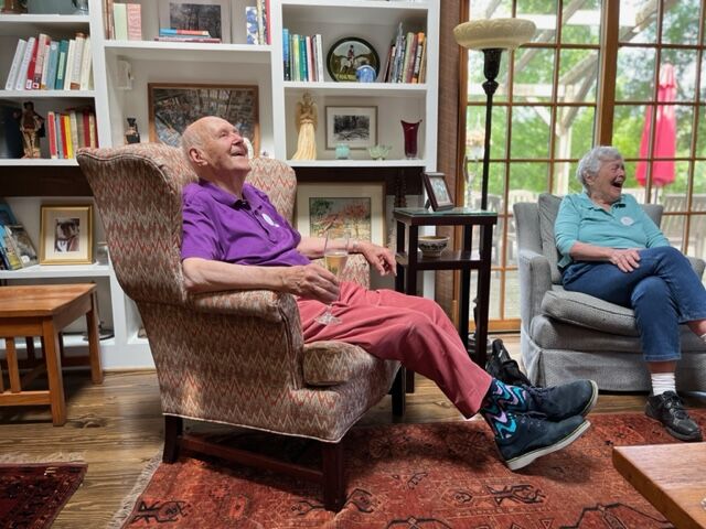 Bill DIetel enjoying an afternoon with Jane Coon and other members of his 'Sherry Assembly' gatherings of widows and widowers.