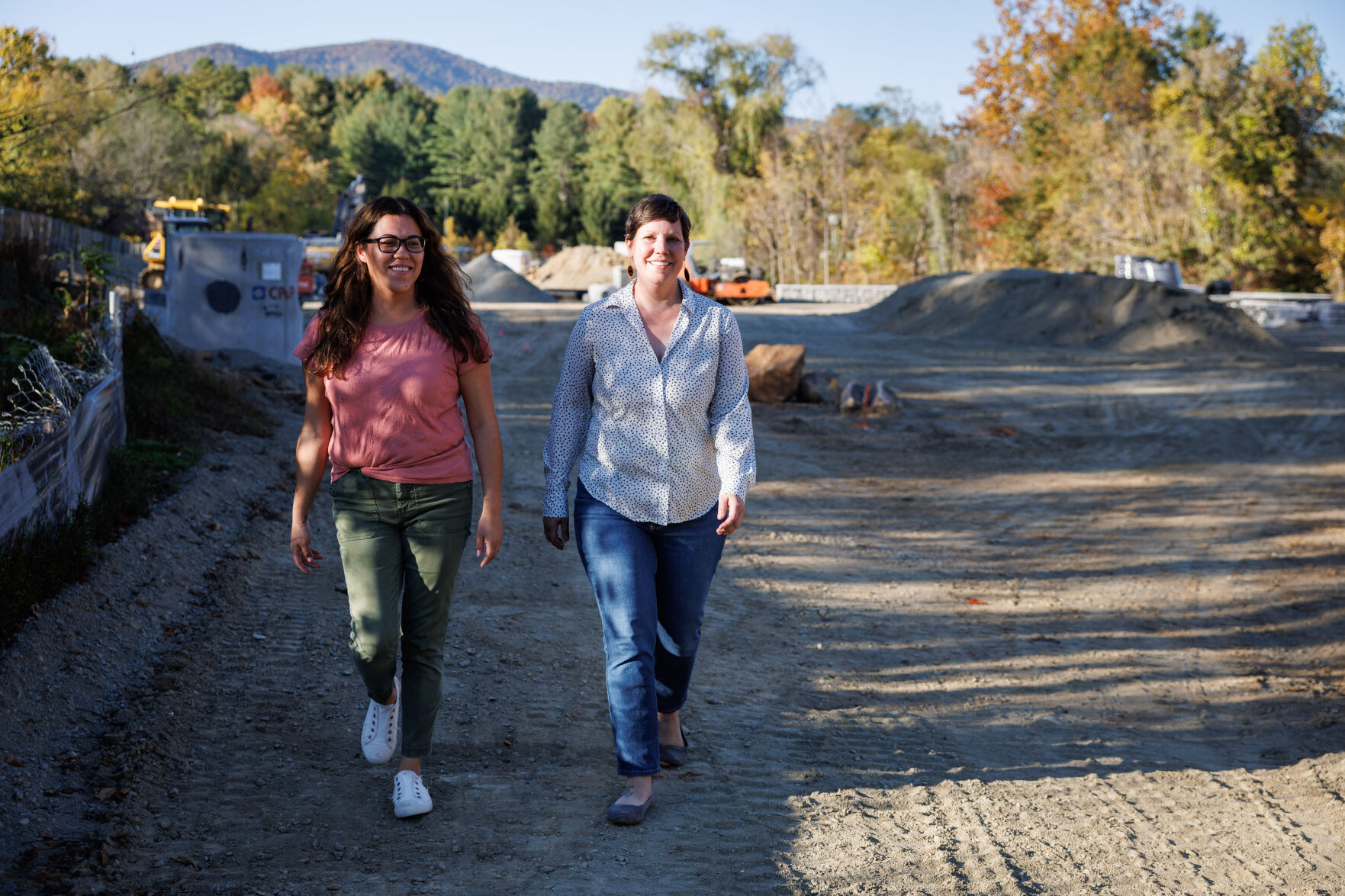 Rappahannock Food Pantry co-managers Laura Lucas and Shauna Volmrich at the Rush River Commons construction site, which will be home of the new pantry's new building.