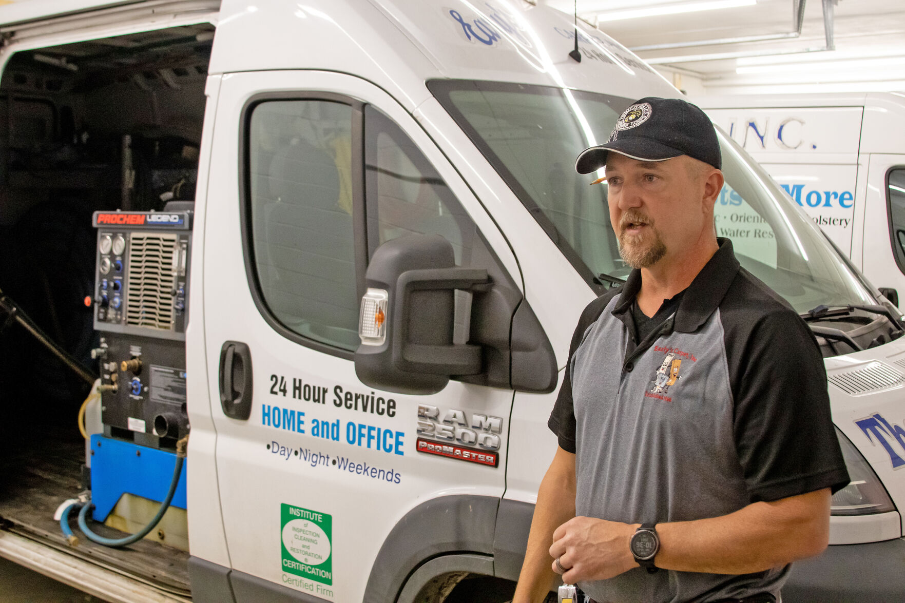 Solon Betts shows off the inside of the Early's Carpet cleaning vans in the new garage space.