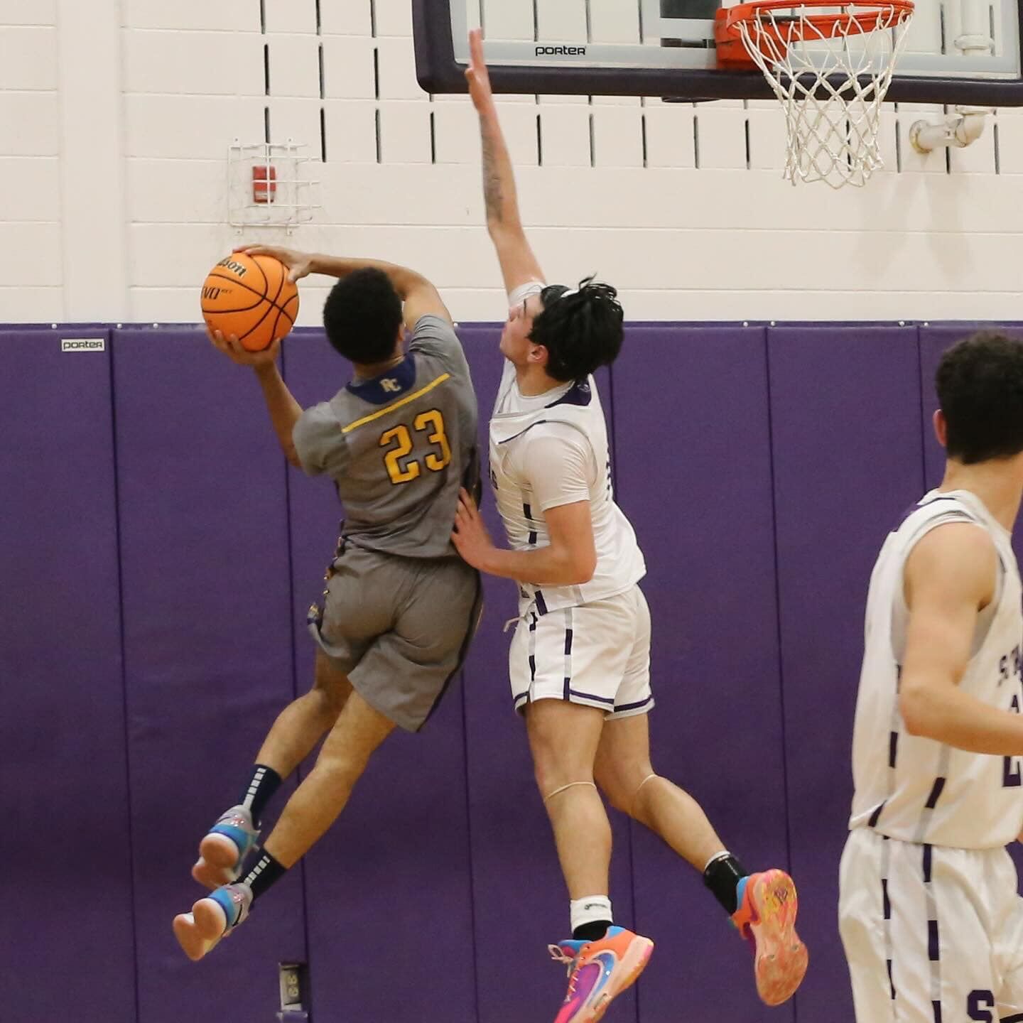 RCHS junior Jeremiah Phillips (23) attempts a basket in the team’s first round district game at the Bull Run District Tournament on Feb. 12.