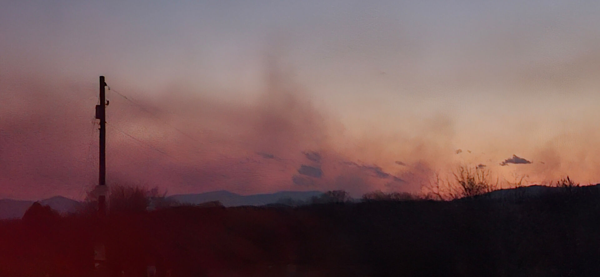 A smoky sunset at Massies Corner on March 20, as fires burned in the county.