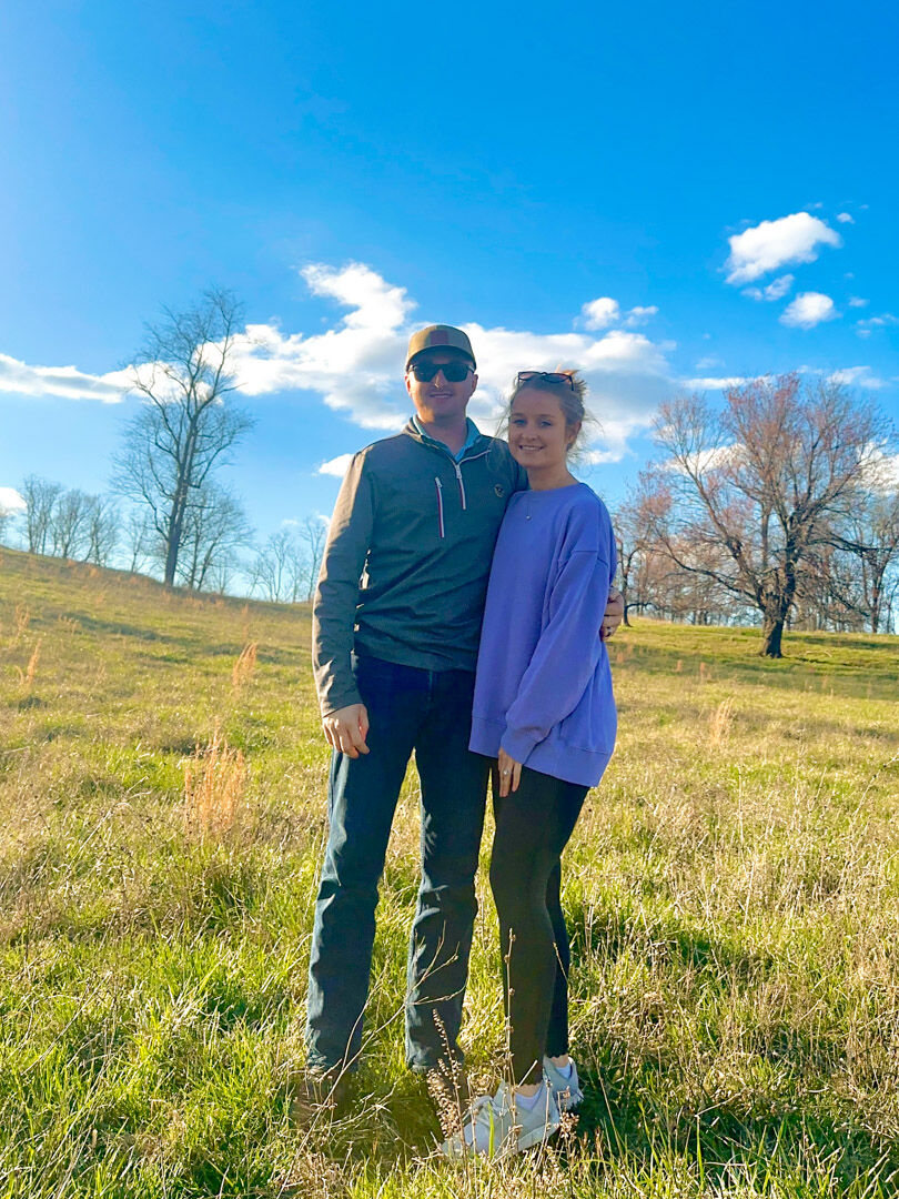 Kayla Midkiff with her husband Dylan on family land in Flint Hill where they are planning to build a house.