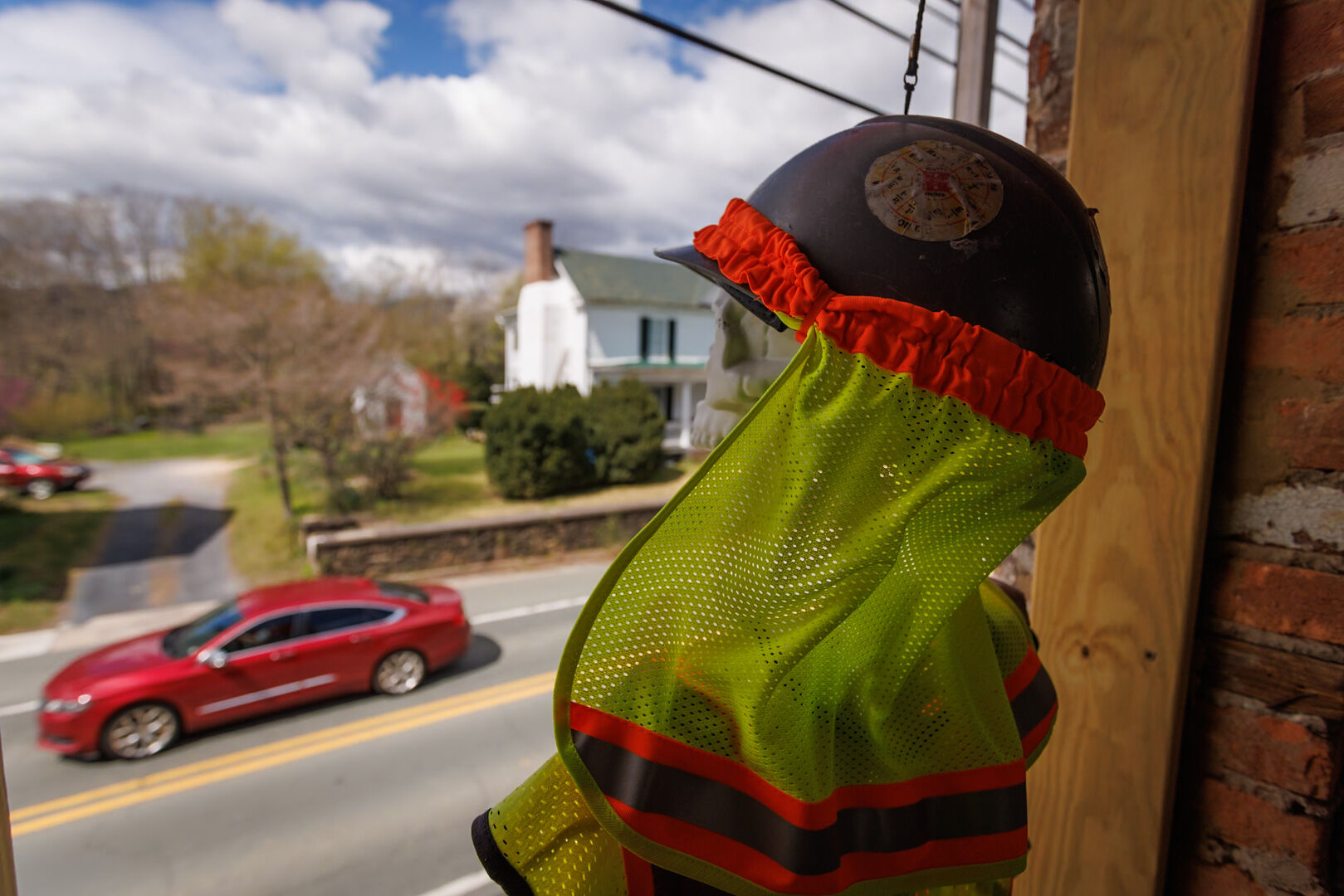 Joe sits watch over Flint Hill in the window of Michael Dennis' historic home on 522.
