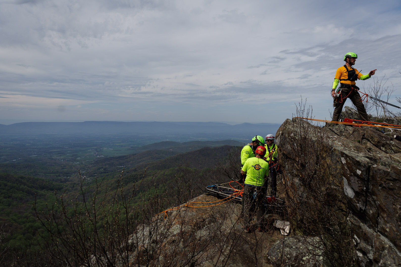 The team prepares to lower a litter off Franklin Cliffs.