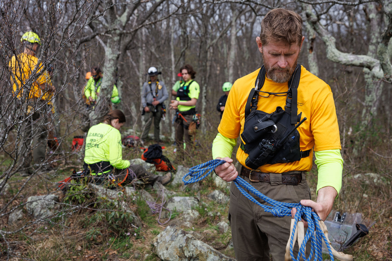 Supervisory Ranger Kevin Moses wraps up training by carefully stowing away climbing rope.