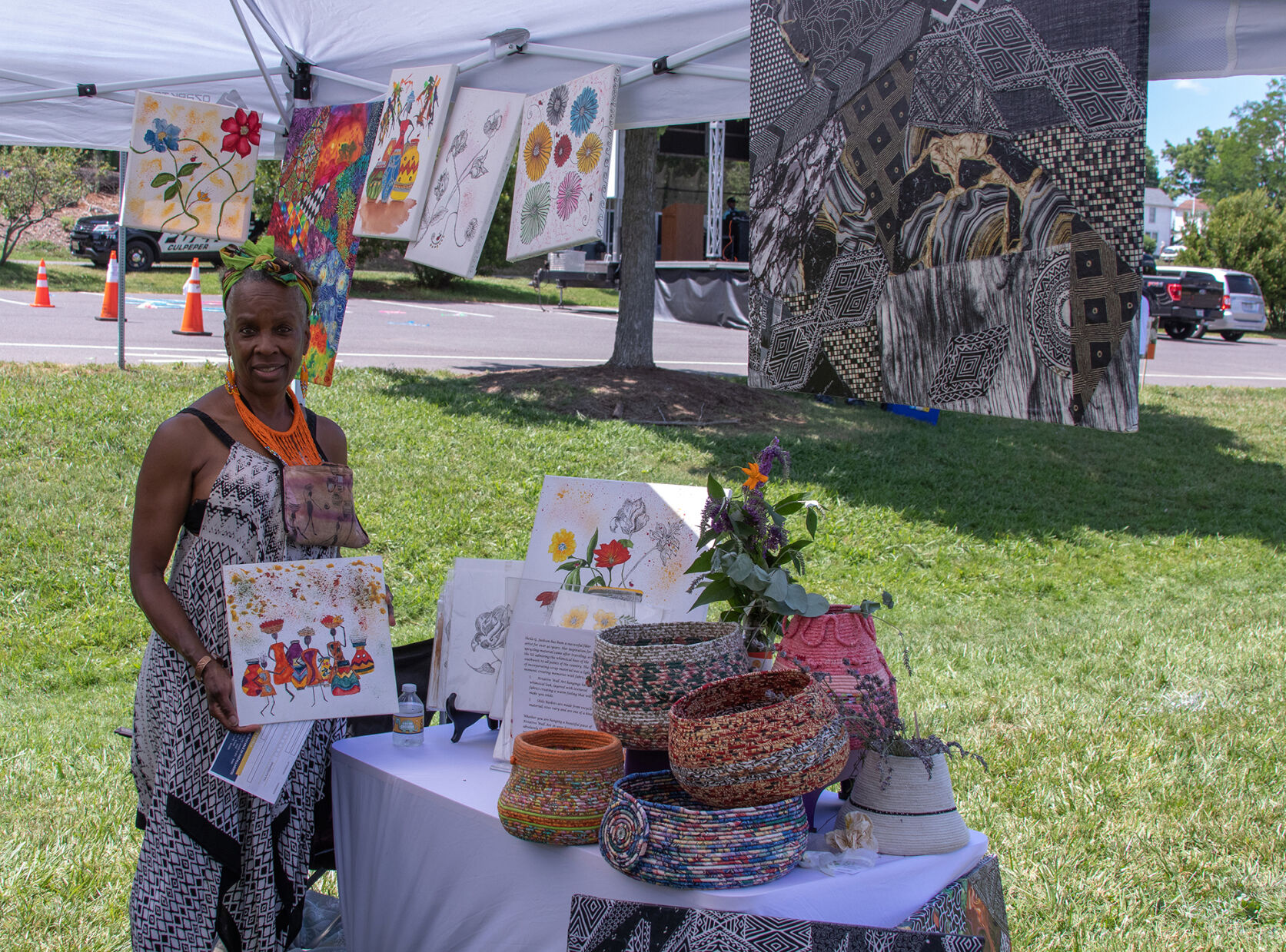 Artist Sheila Jackson poses with her art at Saturday's Juneteenth celebration.