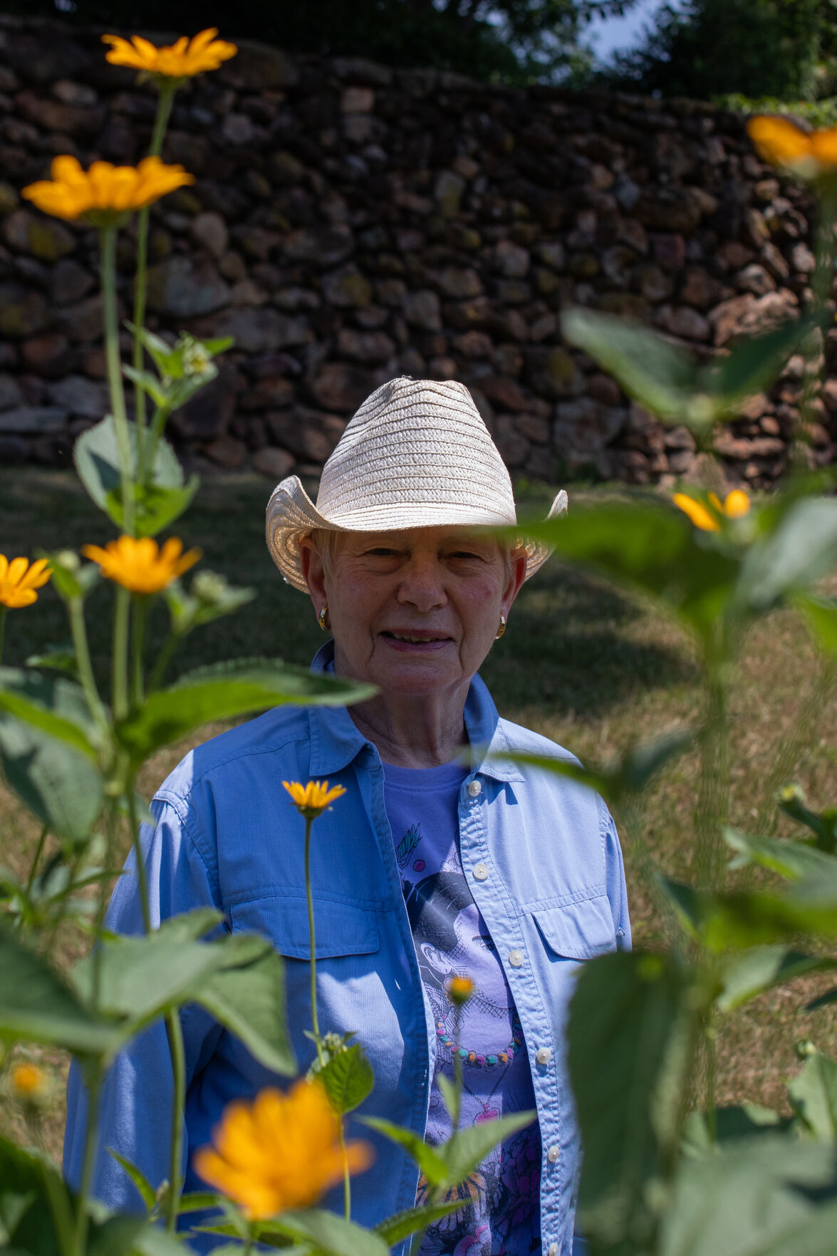 Patti McGill Peterson, board chair of the Shenandoah National Park Trust, sits in her butterfly garden at her home on Oak Hill in Sperryville. The garden is made up fully of native plants.