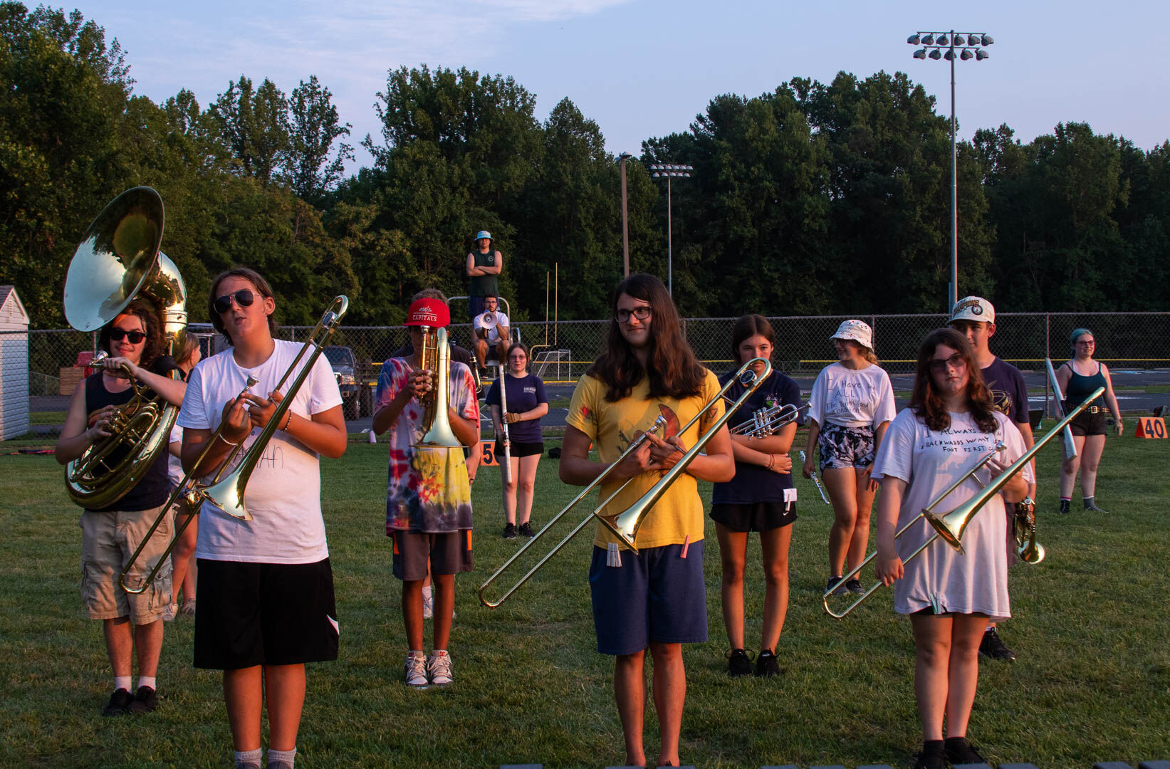 The full band preparing to run a section of their show during a two-hour outdoor rehearsal. (Photo/Ireland Hayes for Foothills Forum)