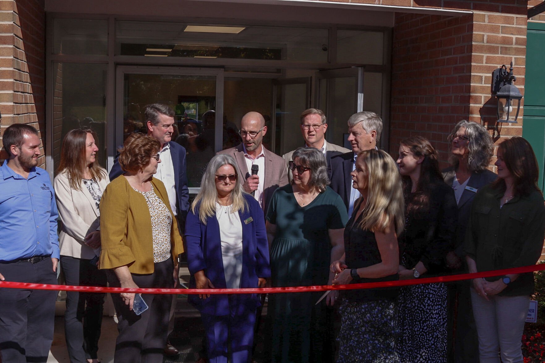 Oak View's Rappahannock community president Jason Brady thanks the crowd for their support, surrounded by bank staff.