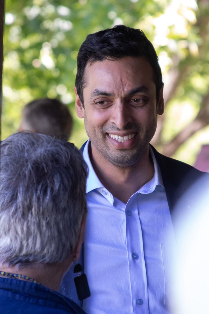 Virginia State Senator and District 10 Democratic congressional candidate Suhas Subramanyam speaks with attendees before the roundtable discussion.