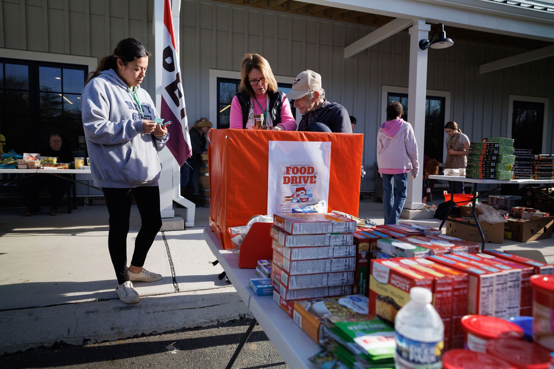 Rappahannock Food Pantry manager Laura Lucas, left, with President Penny Kardis, center and volunteer Steph Ridder last Monday for the Thanksgiving food pick up.