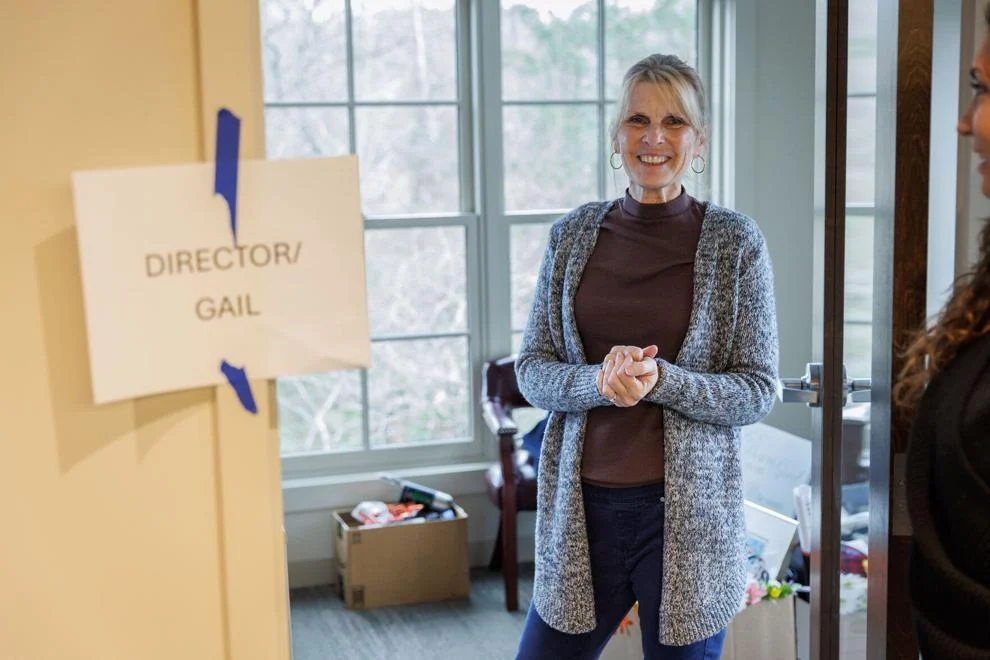 Gail Crooks standing in the doorway of her new office at Rush River Commons