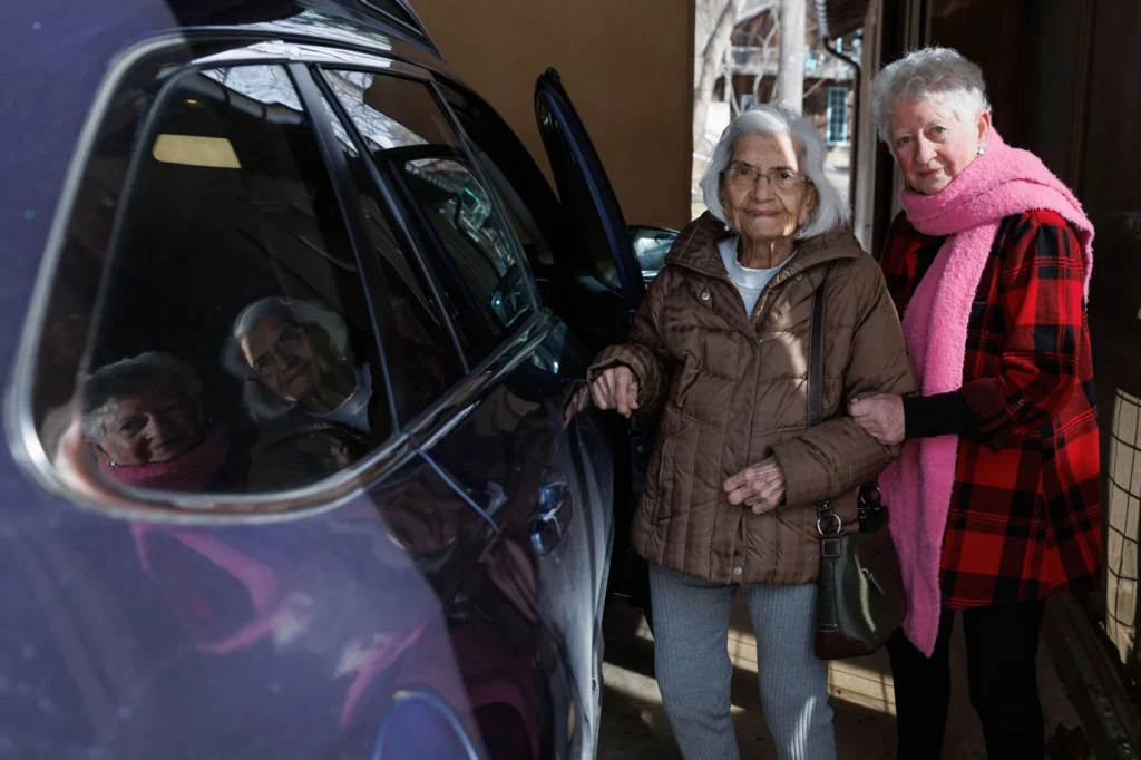 Two women getting into a car