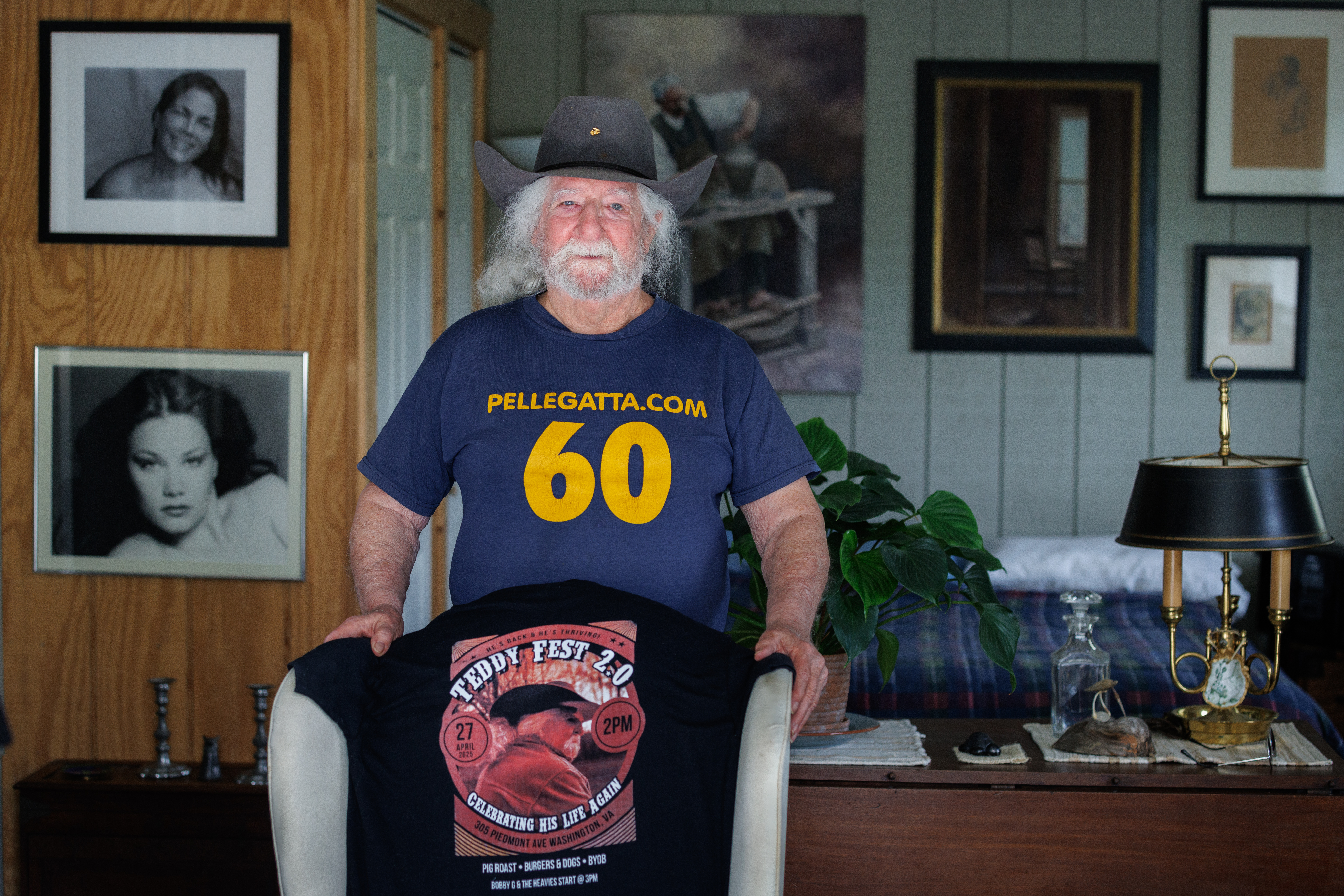 Ted Pellegatta standing in front of a chair with a t-shirt for TedFest draped over it in his home.