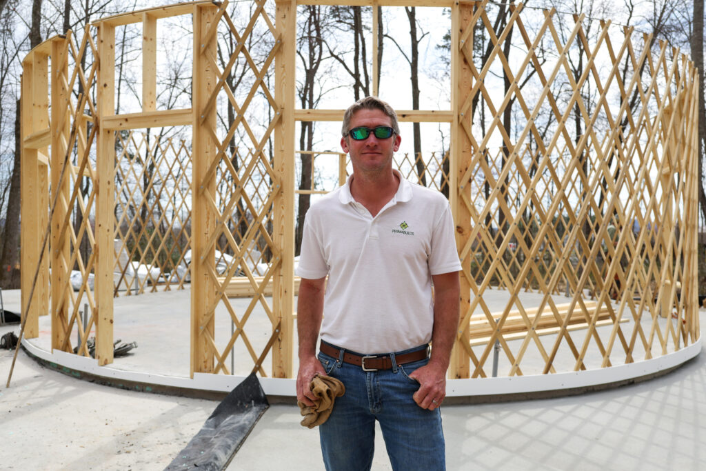 Brian Loch, contractor overseeing the project, in front of one of the partially-constructed yurts. (Photo/Ireland Hayes)